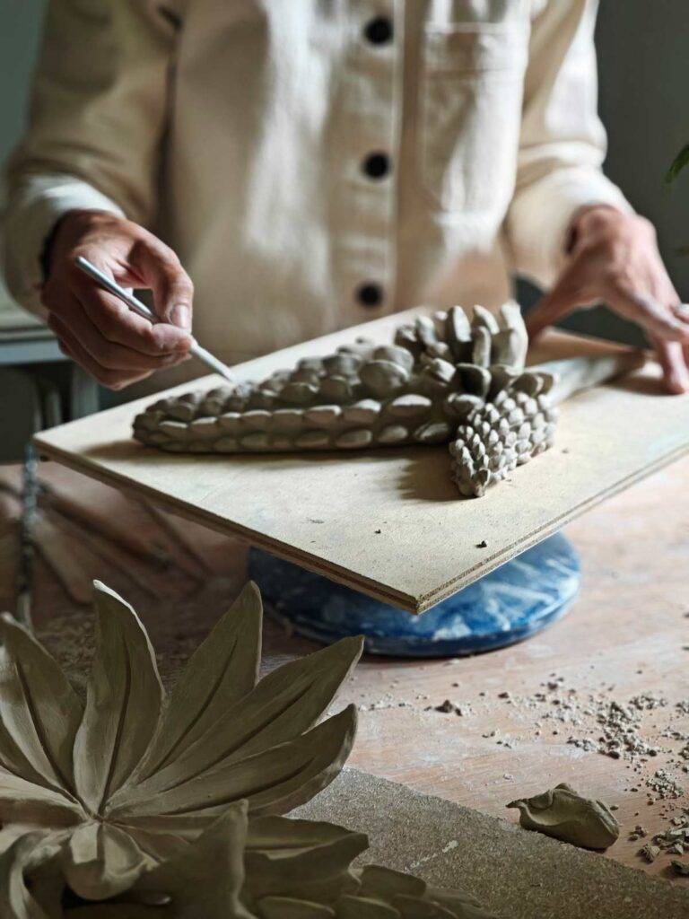 Ceramic artist hand modeling